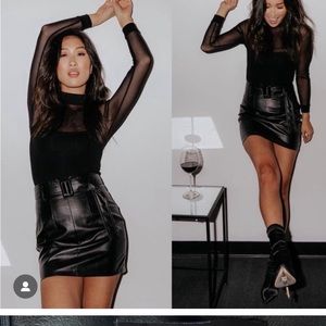 Brand new kittenish faux leather skirt.